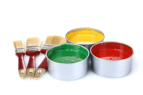 Open tin cans with paint and brushes isolated on white — Stock Photo, Image