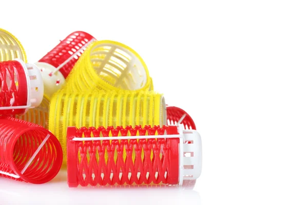 Red and yellow curlers isolated on white — Stock Photo, Image