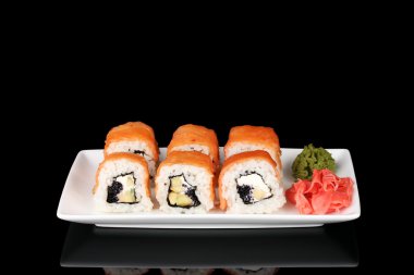 Tasty rolls served on white plate isolated on black clipart