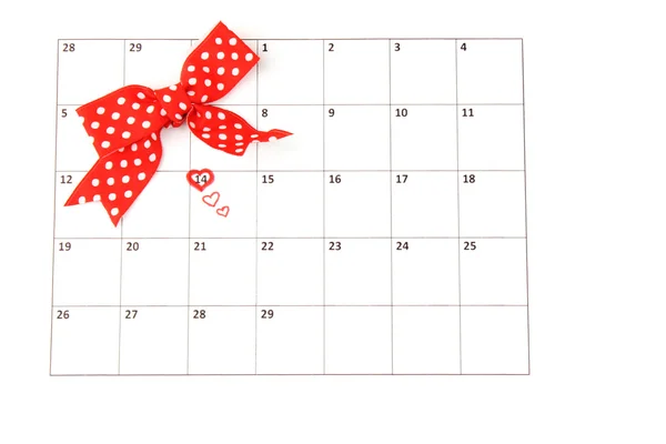 Página del calendario con corazones y arco en el día de San Valentín — Foto de Stock