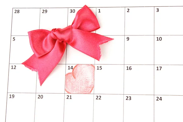 Página del calendario con corazones y arco en el día de San Valentín —  Fotos de Stock