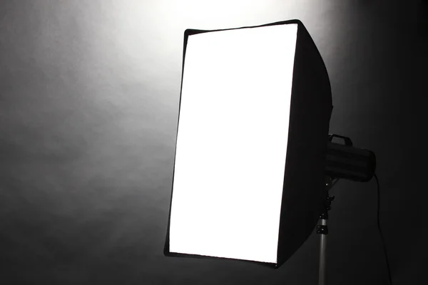 Studio flash with soft-box on grey background — Stock Photo, Image