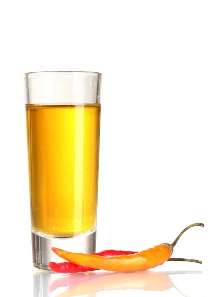 Glass of pepper vodka and red chili peppers isolated on white — Stock Photo, Image