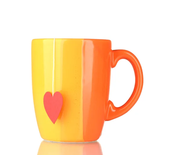 Orange cup and tea bag with red heart-shaped label isolated on white — Stock Photo, Image