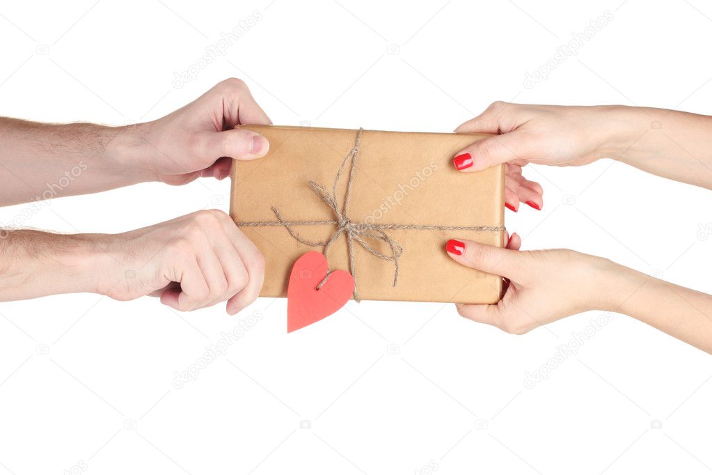 Male hand giving parcel with blank heart-shaped label to woman
