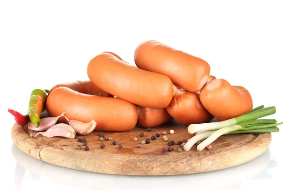 Tasty sausages on wooden board and spices isolation on white — Stock Photo, Image