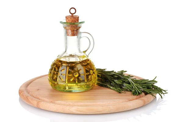 Oil in a bottle and fresh rosemary isolated on white — Stock Photo, Image