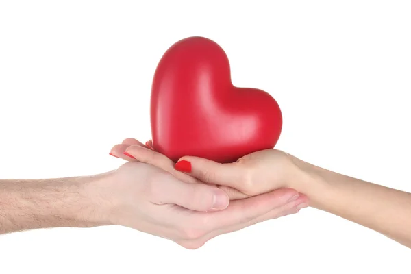 Homem e mulher segurando coração vermelho em mãos isoladas em branco — Fotografia de Stock