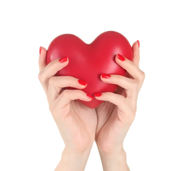 Rött hjärta i kvinnliga händer isolerad på vit — Stockfoto