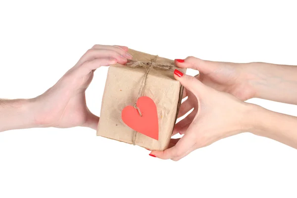 Male hand giving parcel with blank heart-shaped label to woman — Stock Photo, Image