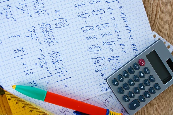 Math on copybook page closeup — Stock Photo, Image