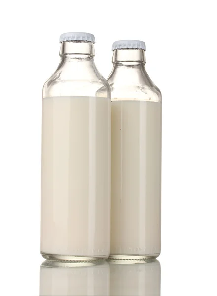 Duas garrafas de leite isoladas em branco — Fotografia de Stock