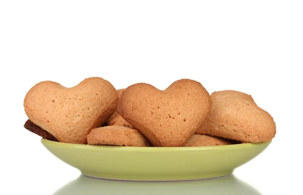 Heart-shaped cookies on green plate isolated on white — Stock Photo, Image
