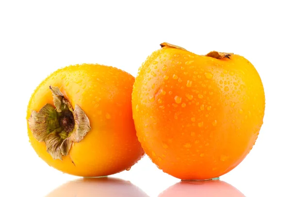 Zwei appetitliche Persimmons mit Tröpfchen isoliert auf weiß — Stockfoto