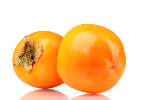 Dwa apetyczne persimmons na białym tle — Zdjęcie stockowe