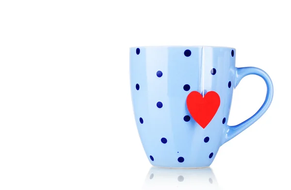 Blue cup and tea bag with red heart-shaped label isolated on white — Stock Photo, Image