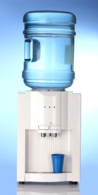 Electric water cooler on blue background clipart