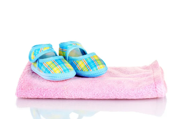 Blue baby booties on pink towel isolated on white — Stock Photo, Image