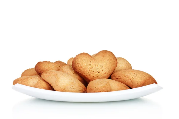 stock image Heart-shaped cookies on white plate isolated on white