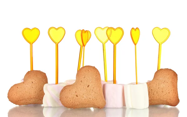 Marshmallows with skewers and heart-shaped cookies isolated on white — Stock Photo, Image