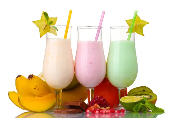 Milk shakes with fruits isolated on white Stock Photo