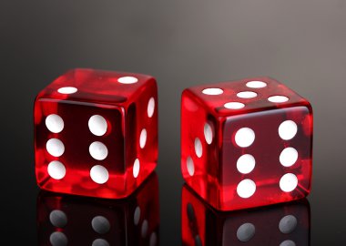 Red dices on grey background clipart