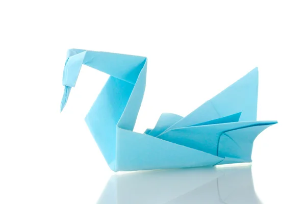 Origami swan out of the blue paper isolated on white — Stock Photo, Image