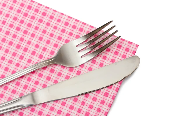 Forchetta e coltello in un panno a quadri isolato su bianco — Foto Stock