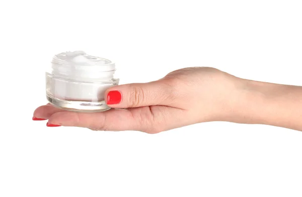 Mano femminile con manicure che tiene la crema su palma isolata su bianco — Foto Stock