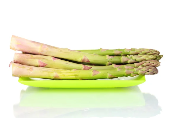 Delicious fresh asparagus on a plate isolated on white — Stock Photo, Image