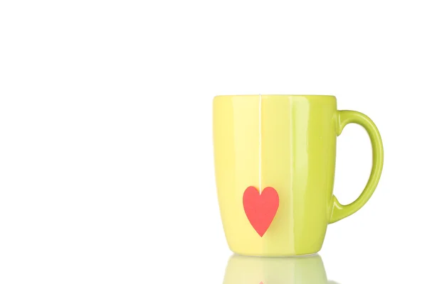 Green cup and tea bag with red heart-shaped label isolated on white — Stock Photo, Image