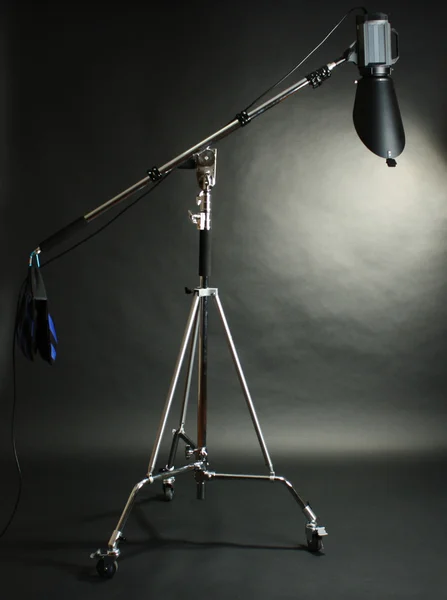 Studio flash with background reflector on black background — Stock Photo, Image