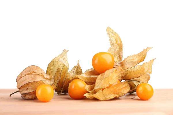 Physalis heap on wooden table on white background — Stock Photo, Image