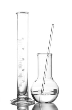 Empty measuring beaker and flask with water and with reflection isolated on