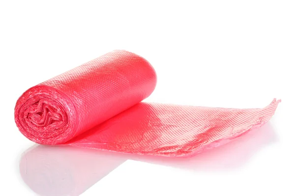 Roll of red garbage bags isolated on white Stock Photo by