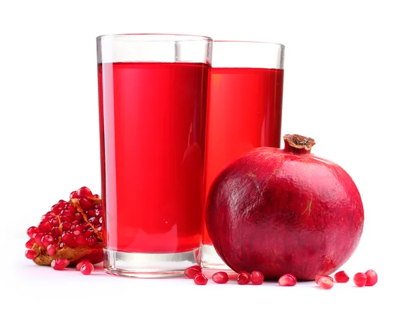 Ripe pomergranate and glasses of juice isolated on white — Stock Photo, Image