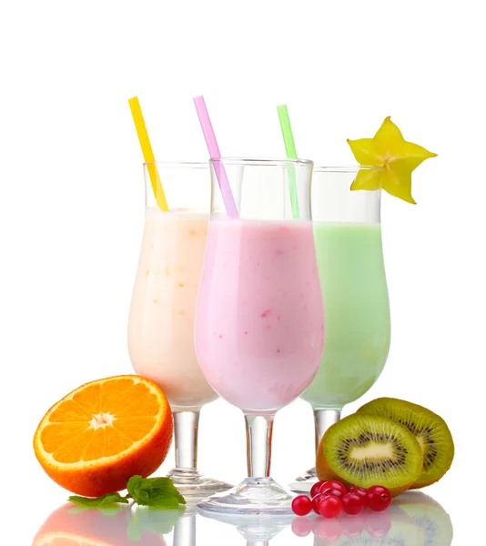 Milk shakes with fruits isolated on white Royalty Free Stock Photos
