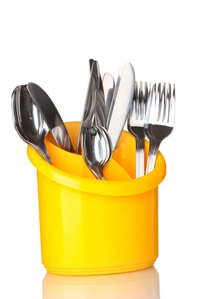 Kuchyňské příbory, nože, vidličky a lžíce žluté stánku izolovaných na bílém — Stock fotografie