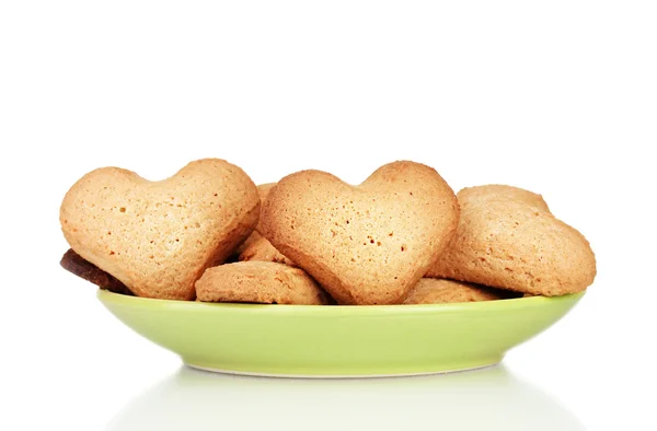 Heart-shaped cookies on green plate isolated on white — Stock Photo, Image