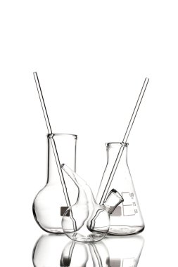 Three empty laboratory glassware with reflection isolated on white clipart