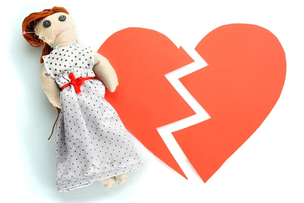 Voodoo doll girl on the broken heart isolated on white — Stock Photo, Image