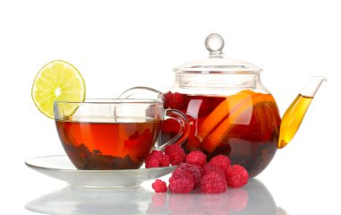 Black fruit tea in glass teapot and cup isolated on white clipart