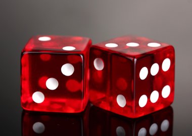 Red dices on grey background clipart