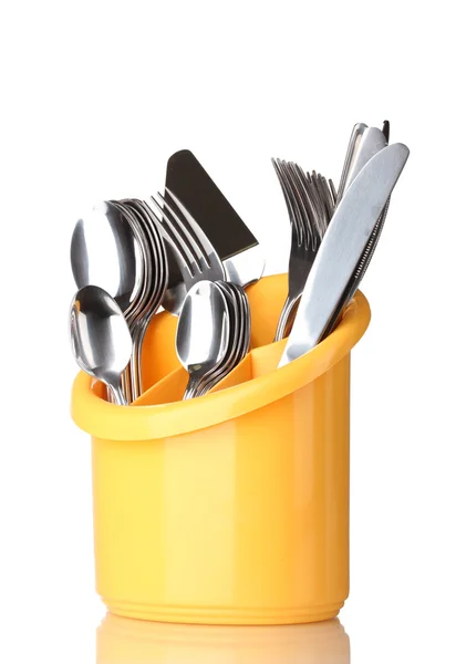 キッチン食器、ナイフ、フォークおよびスプーン白で隔離される黄色のスタンドで — ストック写真