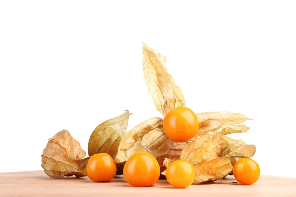 Physalis heap on wooden table on white background — Stock Photo, Image