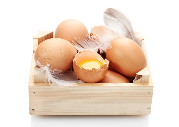 Chicken eggs in wooden box isolated on white — Stock Photo, Image