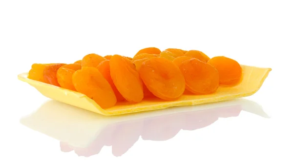 Delicious dried apricots in packaging isolated on white — Stock Photo, Image