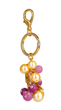 Beautiful golden keychain with precious stones isolated on white clipart