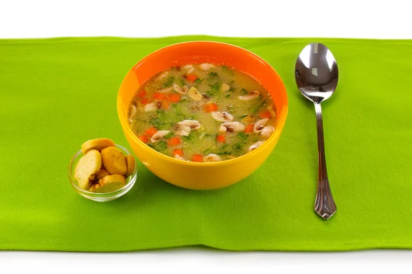 Tasty soup on green tablecloth — Stock Photo, Image