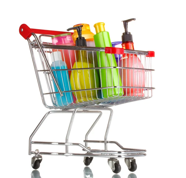 Shopping cart with detergent bottles isolated on white — Stock Photo, Image